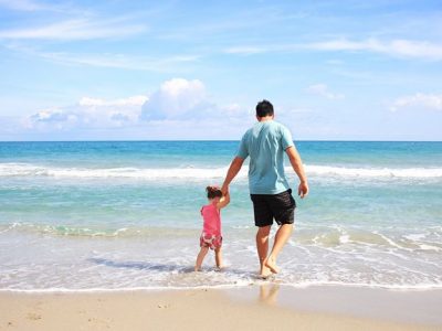 Dad and child on the beach